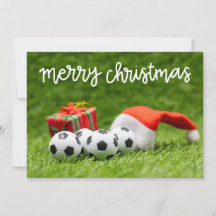 Soccer ball on green grass for Christmas Holiday   Card
