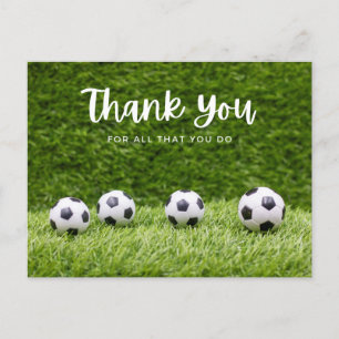 Soccer ball thank you with ball on green grass postcard