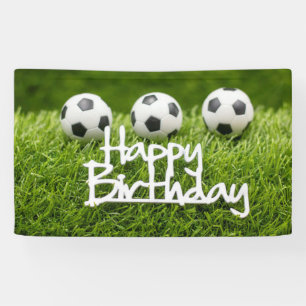 Soccer ball with Happy Birthday sign on green