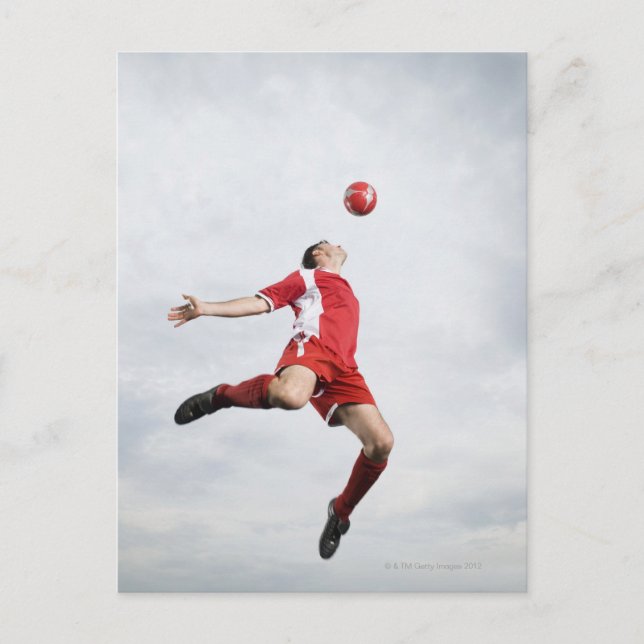 Soccer player and soccer ball in mid-air postcard (Front)