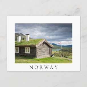 Sod roof log cabin in Norway white text postcard