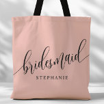 Soft Coral Pink Bridesmaid Modern Script Tote Bag<br><div class="desc">Show your appreciation to your bridal party with this stylish soft coral pink bridesmaid tote bag. Featuring modern script and customisable with your bridesmaid's name, this tote bag is both practical and elegant. The soft colour and chic design make it perfect for carrying wedding day essentials or everyday items. This...</div>