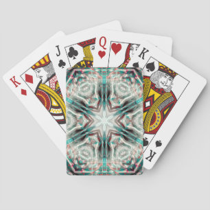 Soft glow on blue sandy texture, kaleidoscope star playing cards