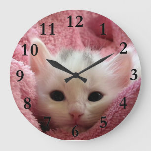 Soft kitten stay at warm large clock