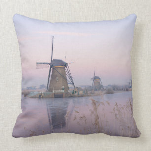 Soft sunrise light in winter over windmills cushion