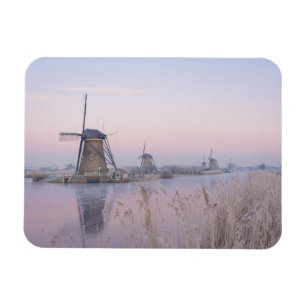 Soft sunrise light in winter over windmills magnet