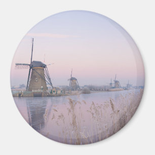 Soft sunrise light in winter over windmills magnet