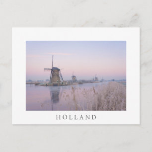 Soft sunrise light in winter over windmills postcard