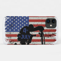 Soldier kneeling silhouette and American flag