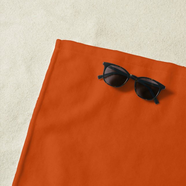Solid colour plain rusty burnt orange beach towel (In Situ)
