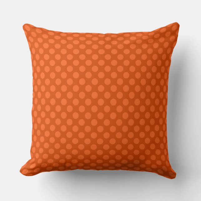 Solid orange polka dots on an orange background cushion (Front)