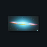 Sombrero Galaxy - M104 - wrapped canvas<br><div class="desc">This floating ring is the size of a galaxy. In fact, it is part of the photogenic Sombrero Galaxy, one of the largest galaxies in the nearby Virgo Cluster of Galaxies. The dark band of dust that obscures the mid-section of the Sombrero Galaxy in optical light actually glows brightly in...</div>