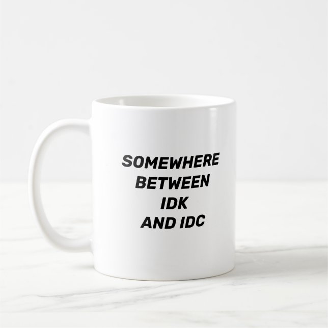 Somewhere Between IDK and IDC Funny Mug (Left)