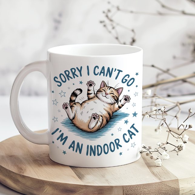 "Sorry I Can't Go, I'm an Indoor Cat" Funny Coffee Mug ("Sorry I Can't Go, I'm an Indoor Cat" Funny Coffee Mug on a sunny boho kitchen table)