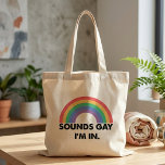 Sounds Gay I'm In Rainbow Pride Quote Tote Bag<br><div class="desc">Sounds Gay I'm In Rainbow Pride Quote features a bold black text design paired with a bright rainbow on a light background. The playful phrase gives the artwork a confident and humourous Pride feel while keeping the message clear and easy to read. Its simple graphic style makes the rainbow and...</div>