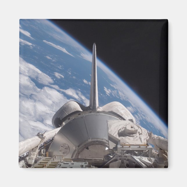 Space Shuttle Discovery backdropped by Earth Magnet (Front)