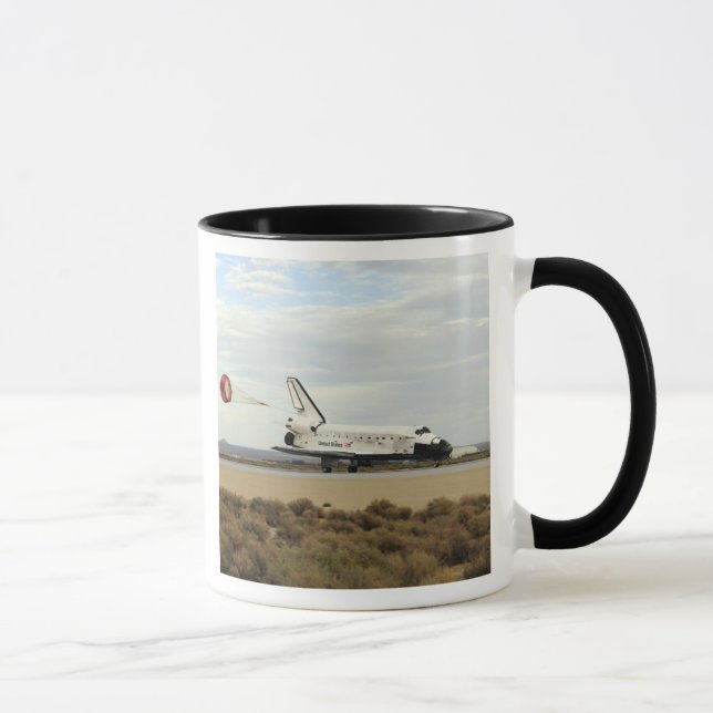 Space Shuttle Discovery deploys its drag chute Mug (Right)