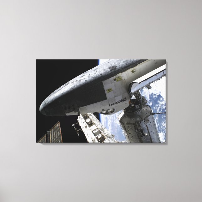 Space Shuttle Discovery docked Canvas Print (Front)