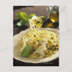 Spaghetti with basil and parmesan on plate, postcard