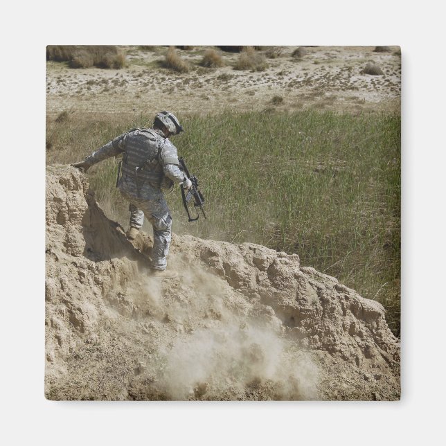 Specialist climbs down magnet (Front)