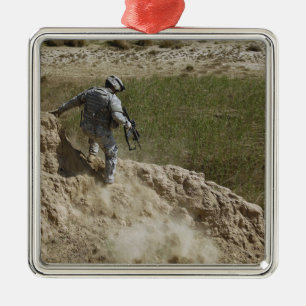 Specialist climbs down metal tree decoration