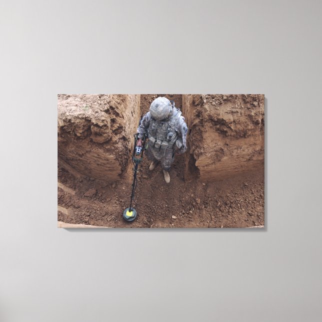 Specialist searches for a weapons cache canvas print (Front)