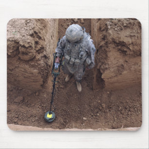 Specialist searches for a weapons cache mouse mat