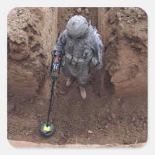 Specialist searches for a weapons cache square sticker