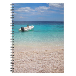 Speedboat in the blue sea notebook