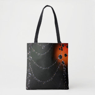 Spiderweb jewels and harvest moon black orange tote bag
