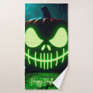 Spooky green glowing Halloween pumpkin Bath Towel