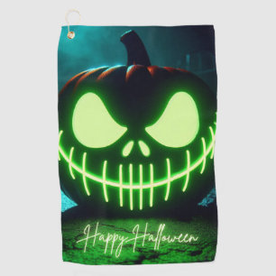 Spooky green glowing Halloween pumpkin Golf Towel