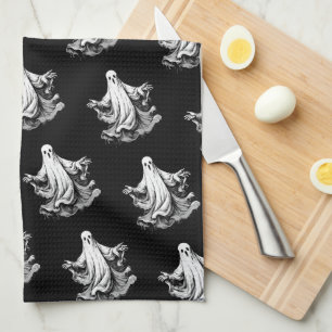 Spooky Halloween with black and white ghosts Tea Towel