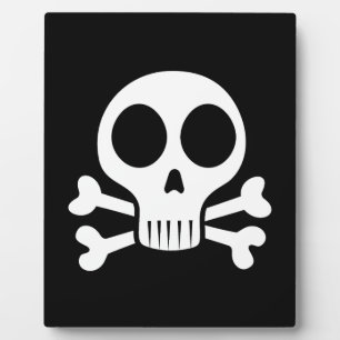 spooky skull on a black background plaque