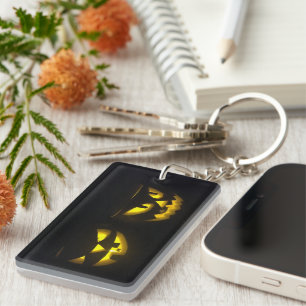 Spooky yellows on black pumpkin face key ring
