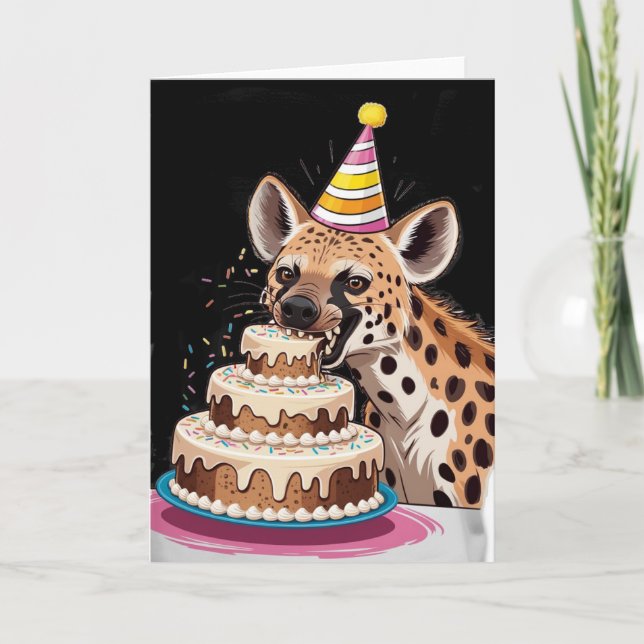 Spotted hyena wearing hat biting into cake card (Front)