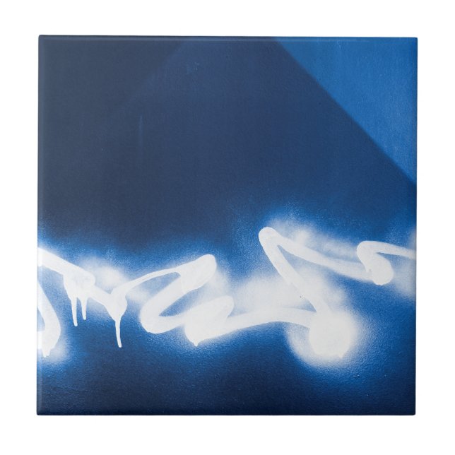 Sprayed graffiti on blue metal tile (Front)
