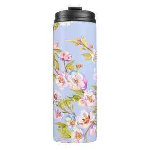 Sprigs of flowering apple or cherry trees on the b thermal tumbler