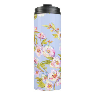 Sprigs of flowering apple or cherry trees on the b thermal tumbler