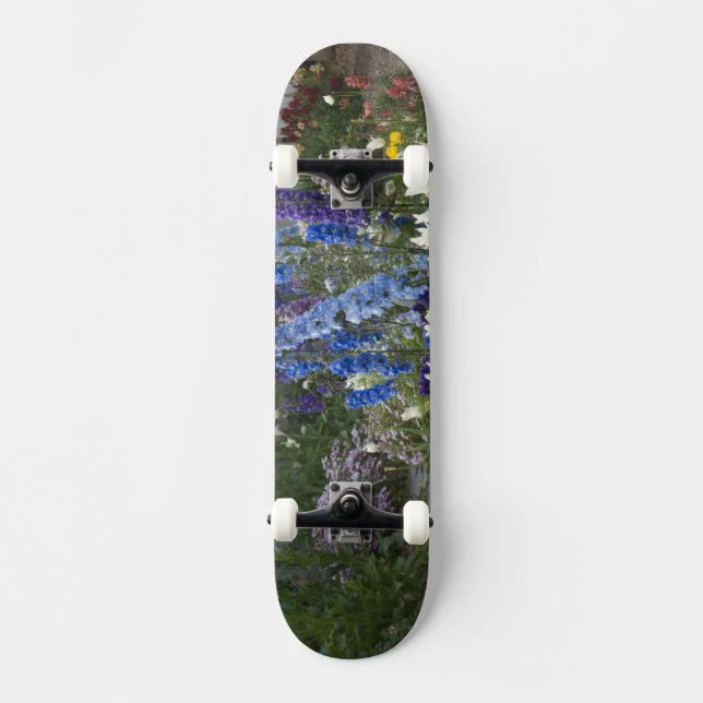 Spring flowers along a garden path, Georgia Skateboard (Front)