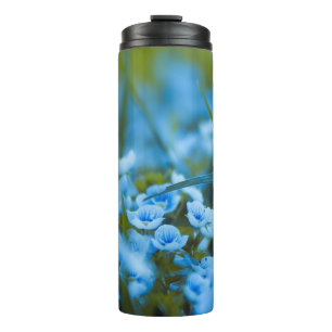 Spring flowers on field thermal tumbler