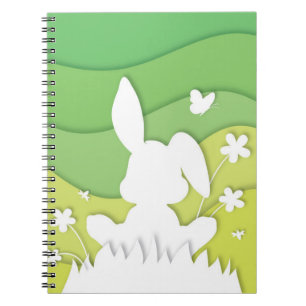 Spring landscape, easter bunny on grass notebook