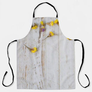 Spring yellow flowers, white plank decor. apron