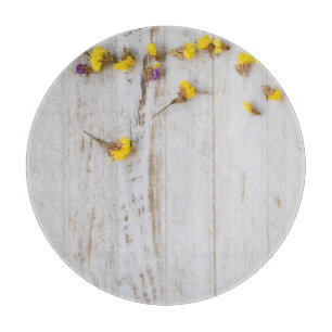 Spring yellow flowers, white plank decor. cutting board