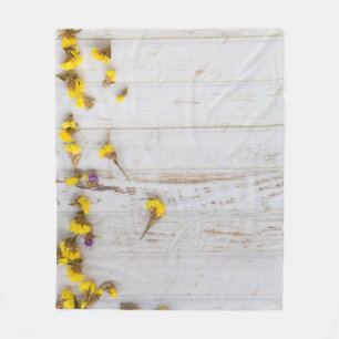 Spring yellow flowers, white plank decor. fleece blanket
