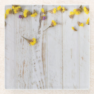 Spring yellow flowers, white plank decor. glass coaster