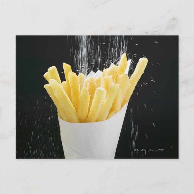 Sprinkling salt on chips in paper cone postcard (Front)