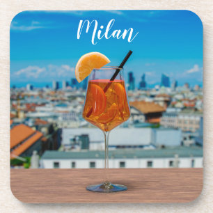 Spritz cocktail on a table with view of Milan Coaster