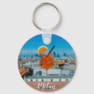 Spritz cocktail on a table with view of Milan Key Ring