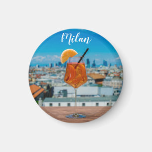 Spritz cocktail on a table with view of Milan Magnet